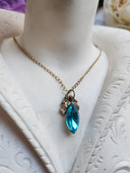 Arcane Resonance Collection – Handmade Bronze Pendant with Electric Blue Navette Crystal