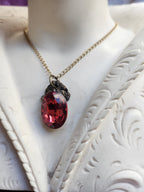 Arcane Resonance Collection – Small Handmade Bronze Pendant with Light Red Oval Crystal