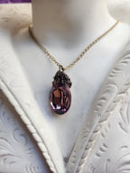 Arcane Resonance Collection – Small Handmade Bronze Pendant with Dusty Rose Oval Crystal