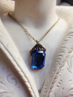 Arcane Resonance Collection – Handmade Bronze Pendant with Blue Octagon Crystal