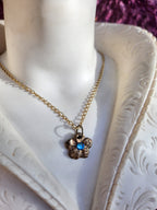 Eternal Bloom Collection – Handmade Bronze Flower Pendant with Light Blue Crystal