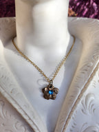 Eternal Bloom Collection – Handmade Bronze Flower Pendant with Light Blue Crystal
