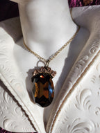 Mystic Baroque Collection – Handmade Bronze Pendant with Brown Oval Crystal