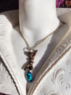 Echoes of Heaven Collection - Handmade Bronze Angel Pendant with Emerald Aurora Crystal