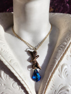Echoes of Heaven Collection - Handmade Bronze Angel Pendant with Deep Sapphire Crystal