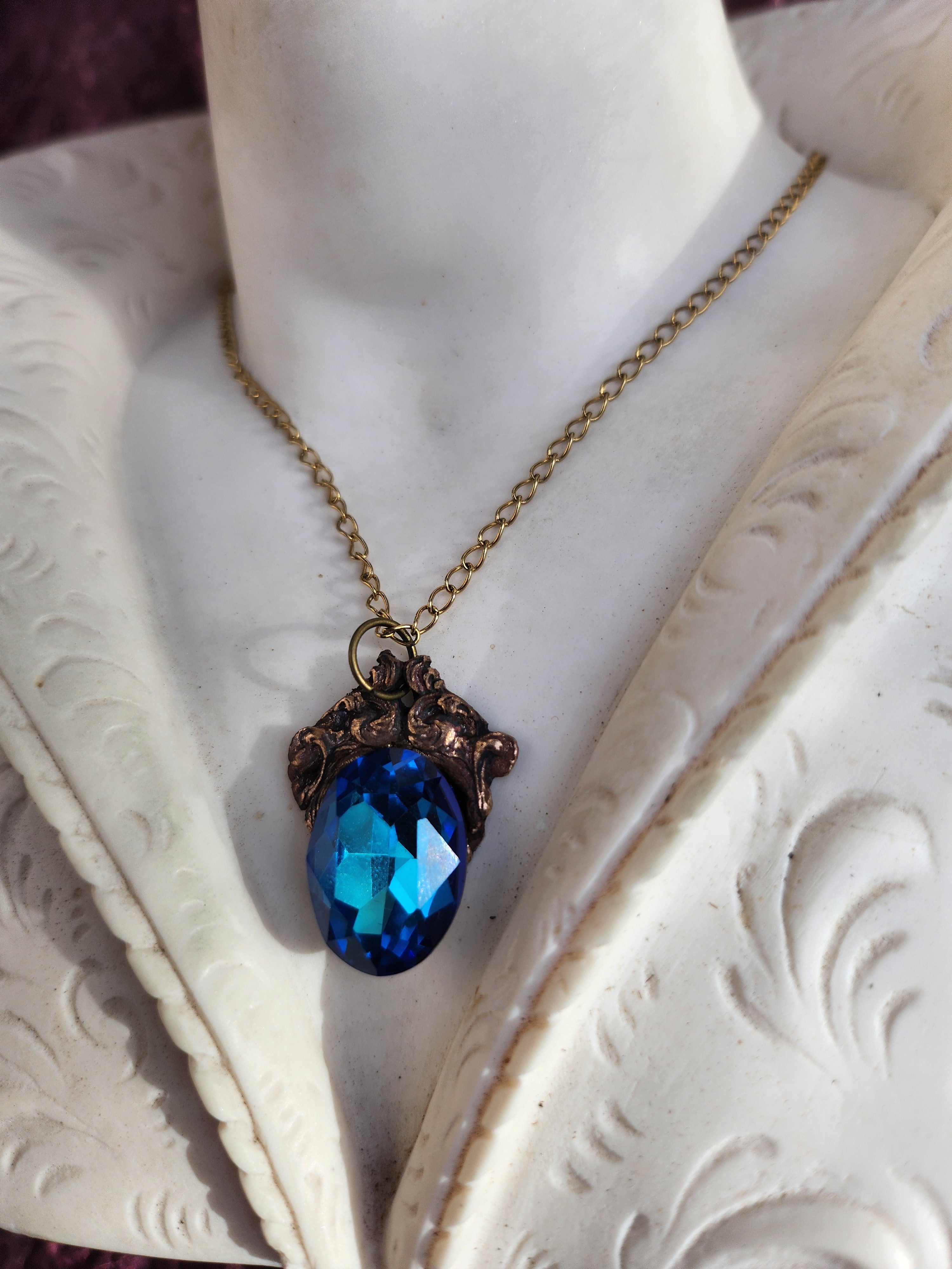 Arcane Resonance Collection – Handmade Bronze Pendant with Blue Oval Crystal