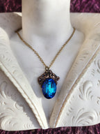 Arcane Resonance Collection – Handmade Bronze Pendant with Blue Oval Crystal