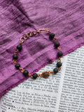 Pulsera artesanal de piedra volcánica y cobre